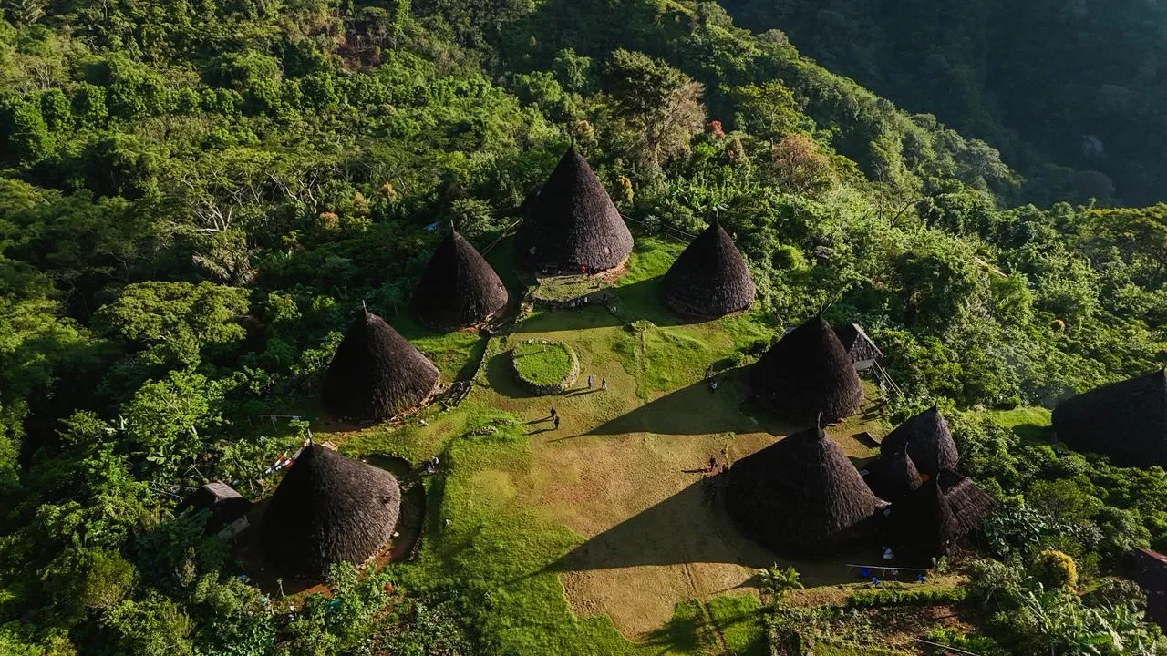 Wae Rebo's cone-shaped houses in the green mountains