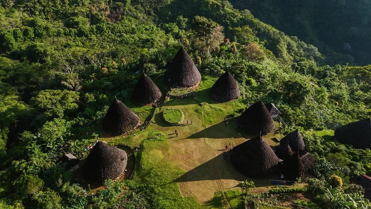 Aerial view of the cone-roofed houses of Wae Rebo